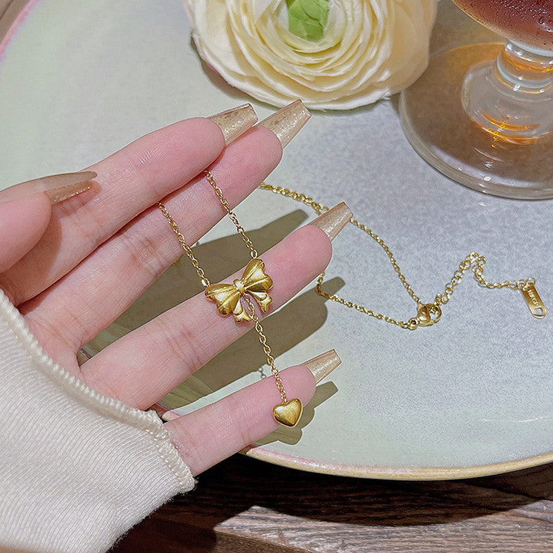 Charm Cascade Bow Necklace