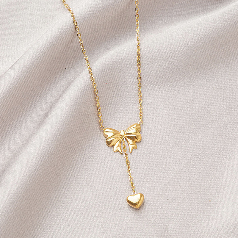 Charm Cascade Bow Necklace